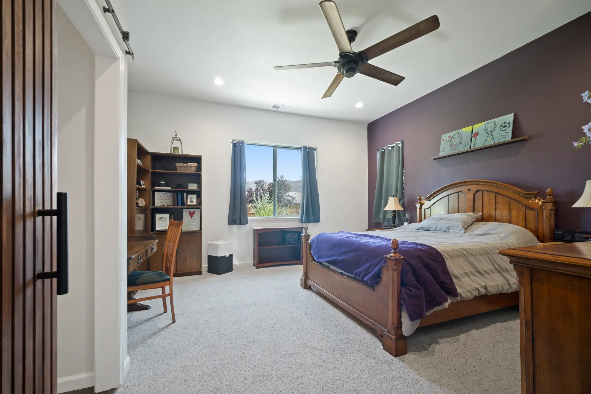 Bedroom with carpet and natural lighting at Seven Pines Court mountain home in Damonte Ranch Reno Nevada