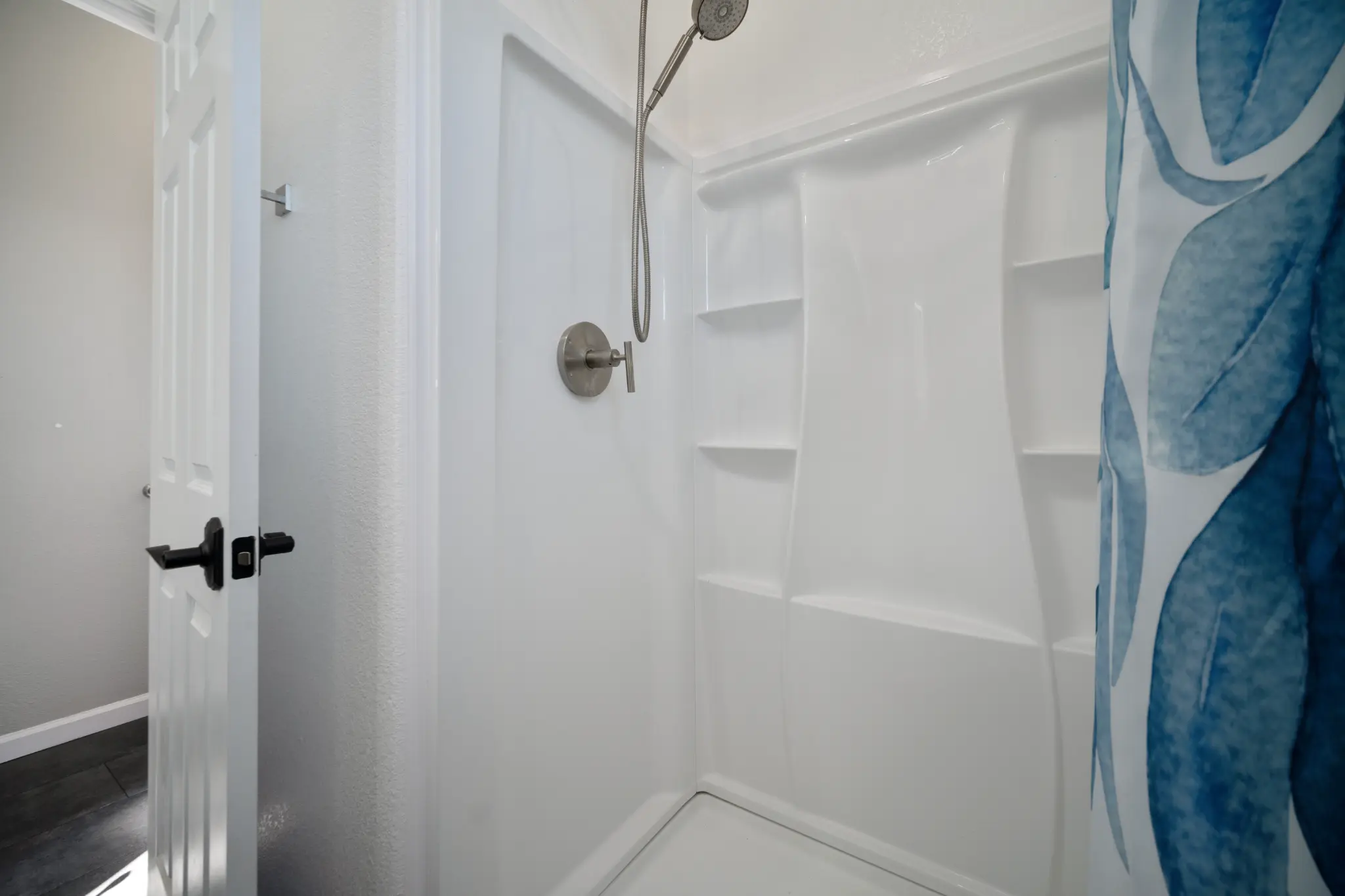 Guest bathroom renovation with modern tile and fixtures at Seven Pines Court home in South Reno by Avail Enterprises general contractor