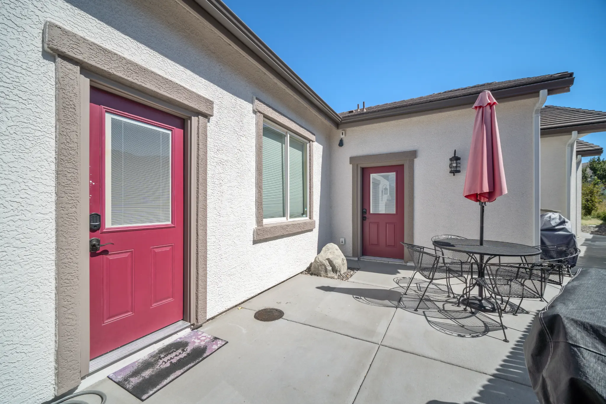 Side elevation of Seven Pines Court home showing stone and wood siding in Virginia Foothills Reno Nevada