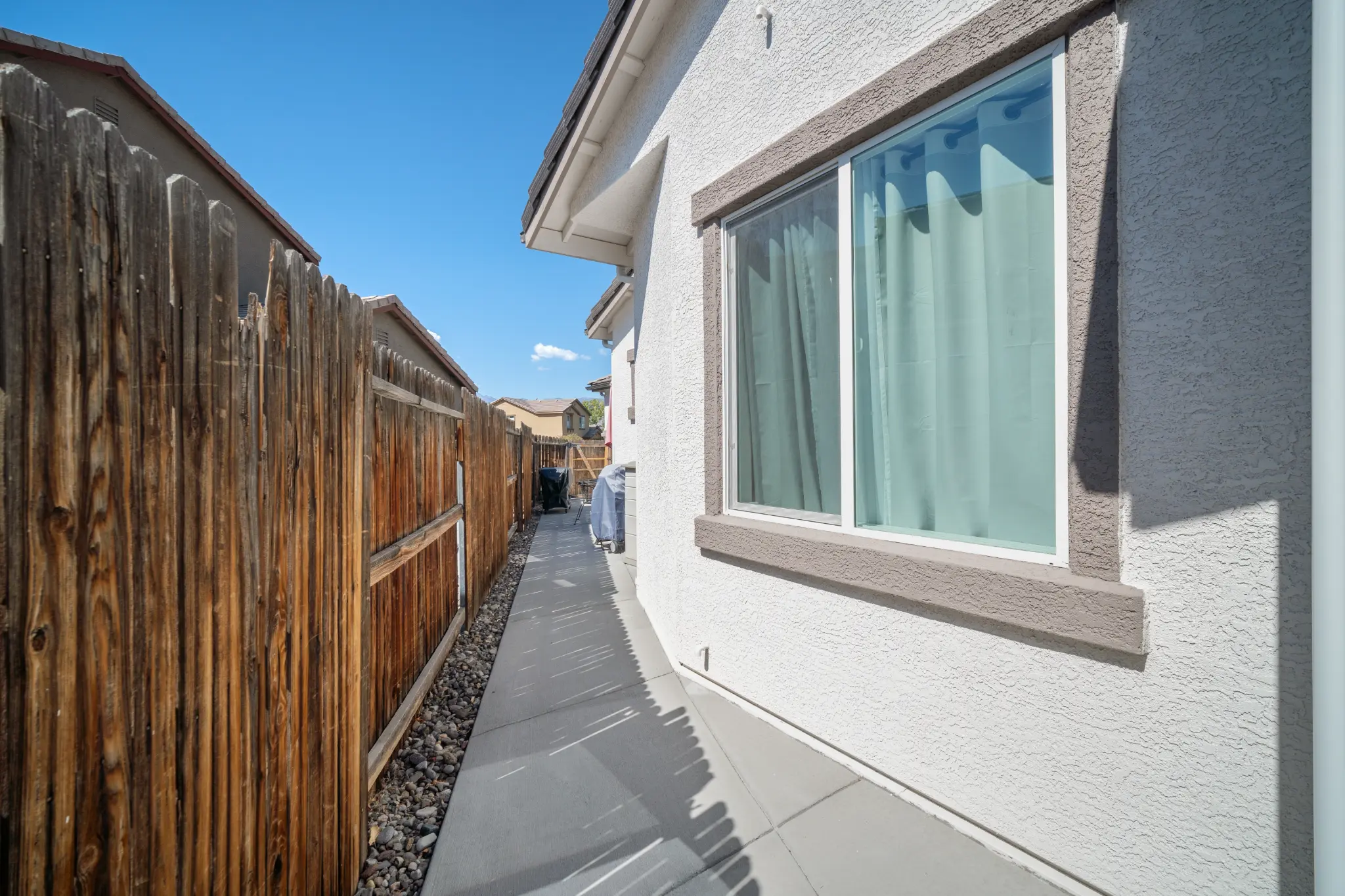 Metal roof and stone facade detail on Seven Pines Court mountain home in South Reno NV