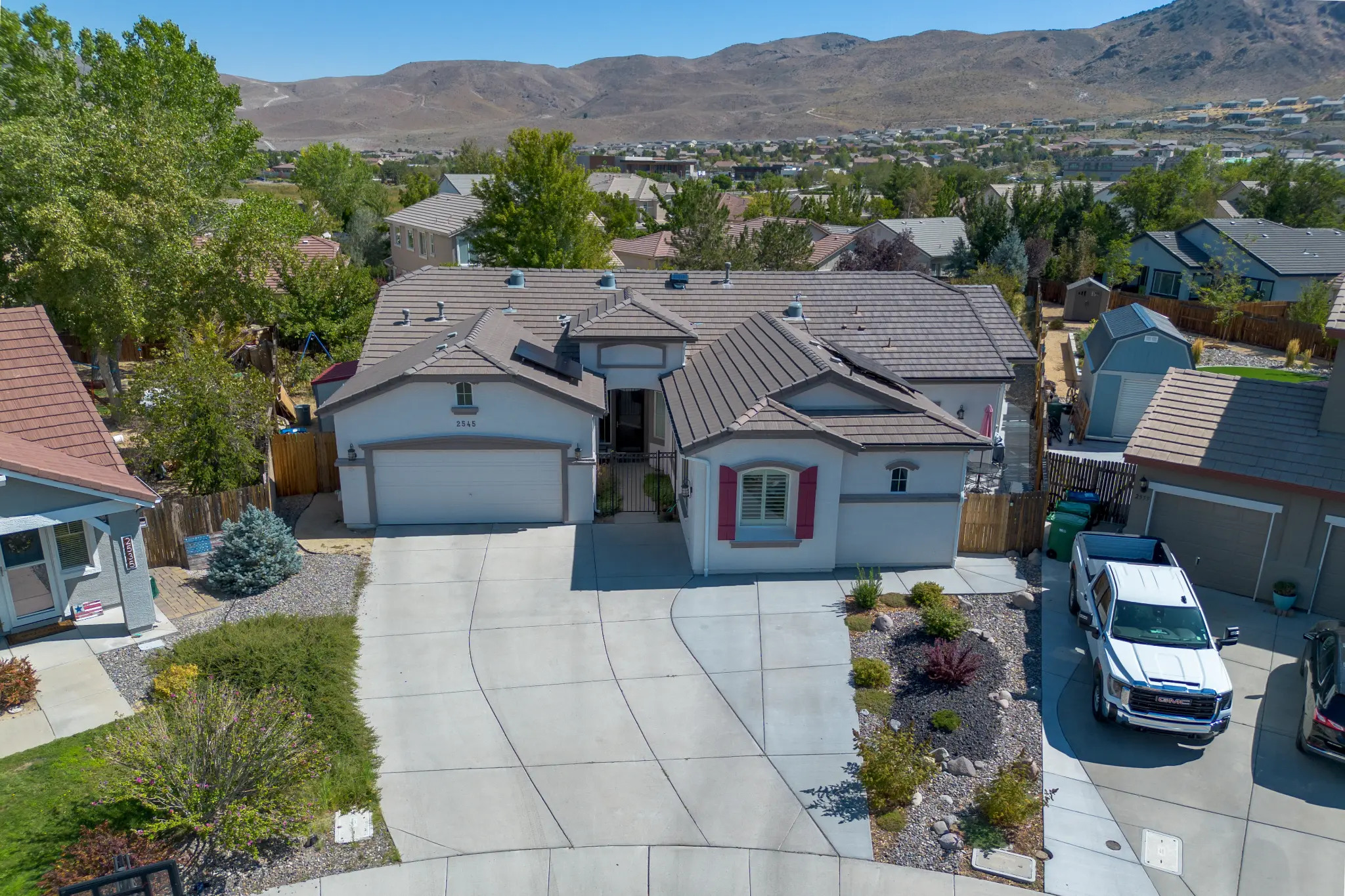 Landscaping and exterior lighting at Seven Pines Court home in Damonte Ranch South Reno NV