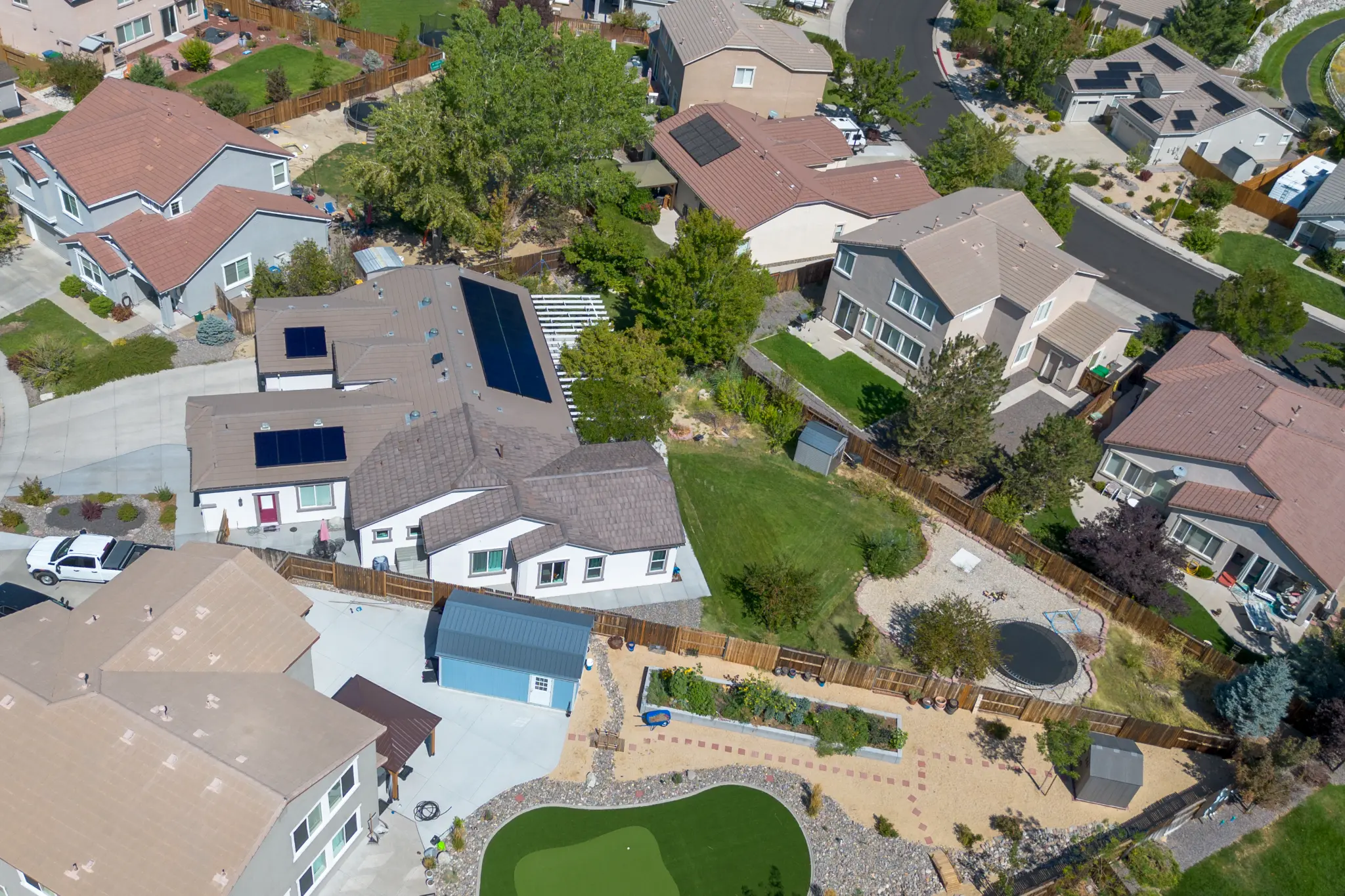Stone and wood exterior materials on Seven Pines Court home in Virginia Foothills South Reno
