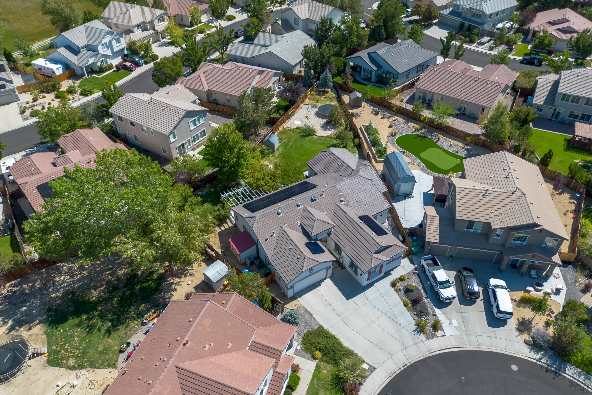 Evening view of Seven Pines Court luxury home with exterior lighting in South Reno NV 89521